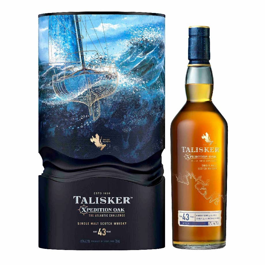 A chest of Talisker 43-Year-Old Xpedition Oak: The Atlantic Challenge with ocean and sailboat images, along with a bottle of whiskey.